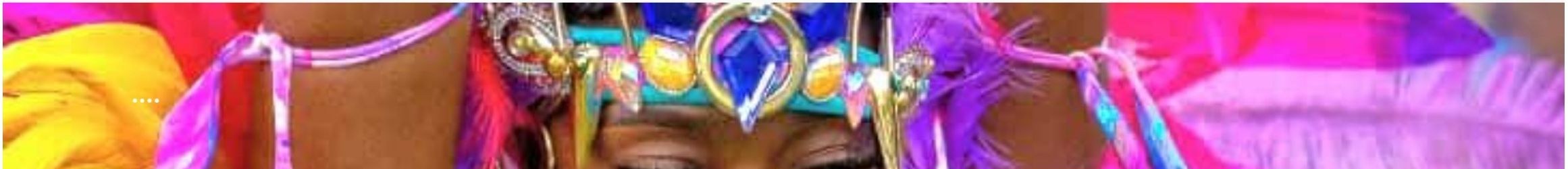 Carnival masquerader in feathered headpiece